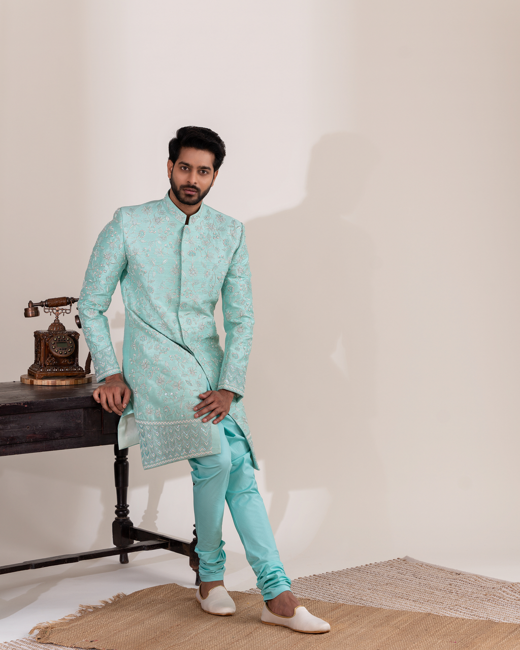 Full front view showcasing the aqua blue sherwani’s refined silhouette.