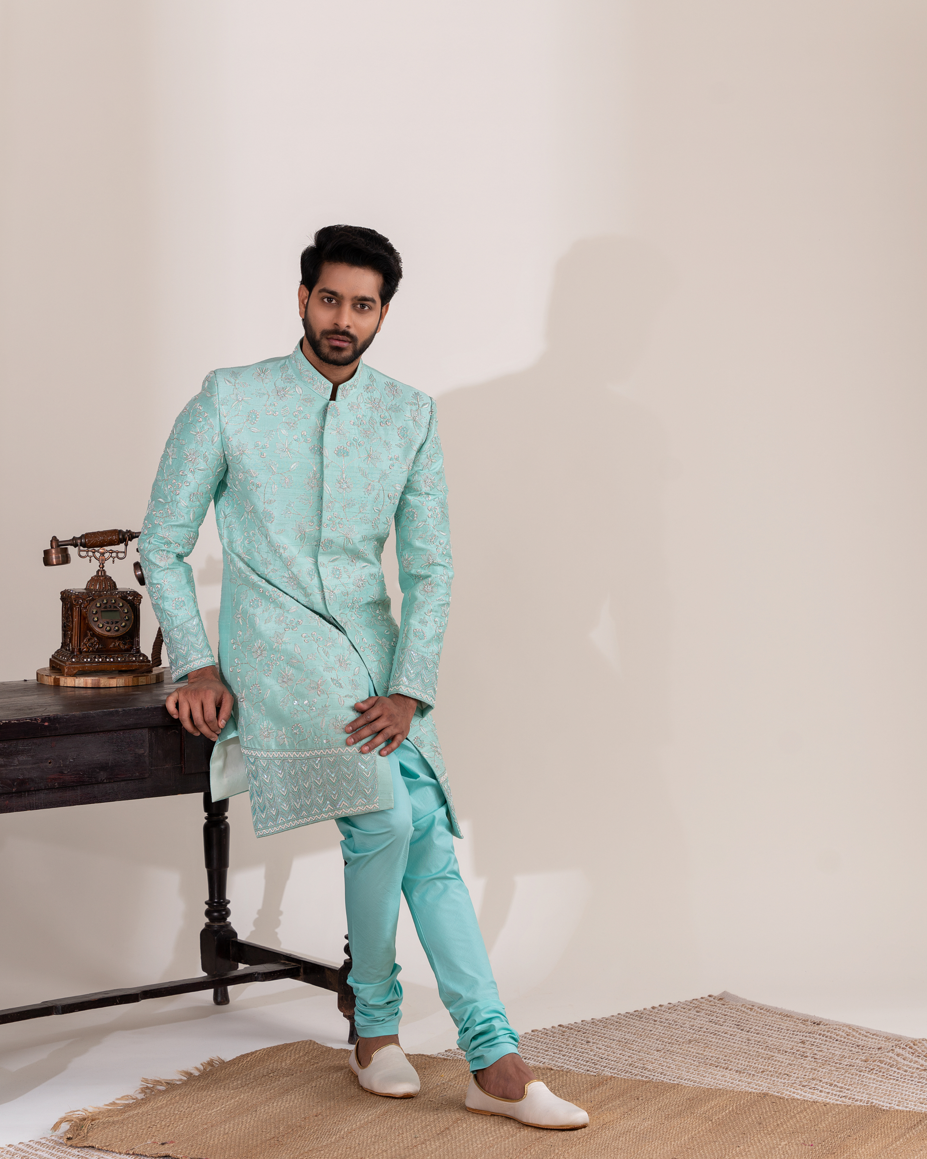 Full front view showcasing the aqua blue sherwani’s refined silhouette.