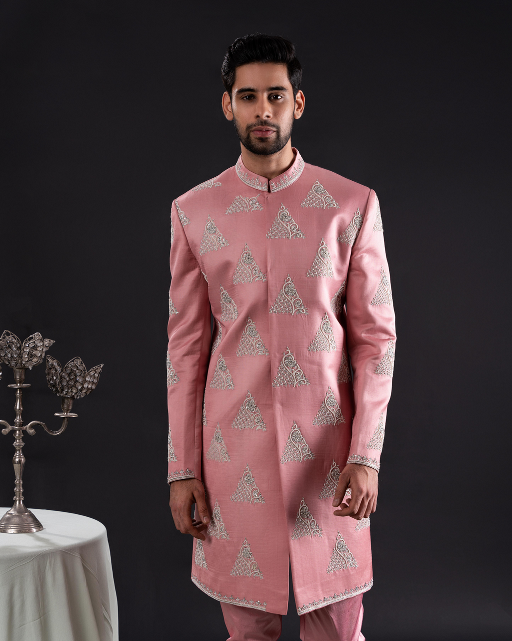 Front angle highlighting salmon sherwani fit and pearl accents embroidery